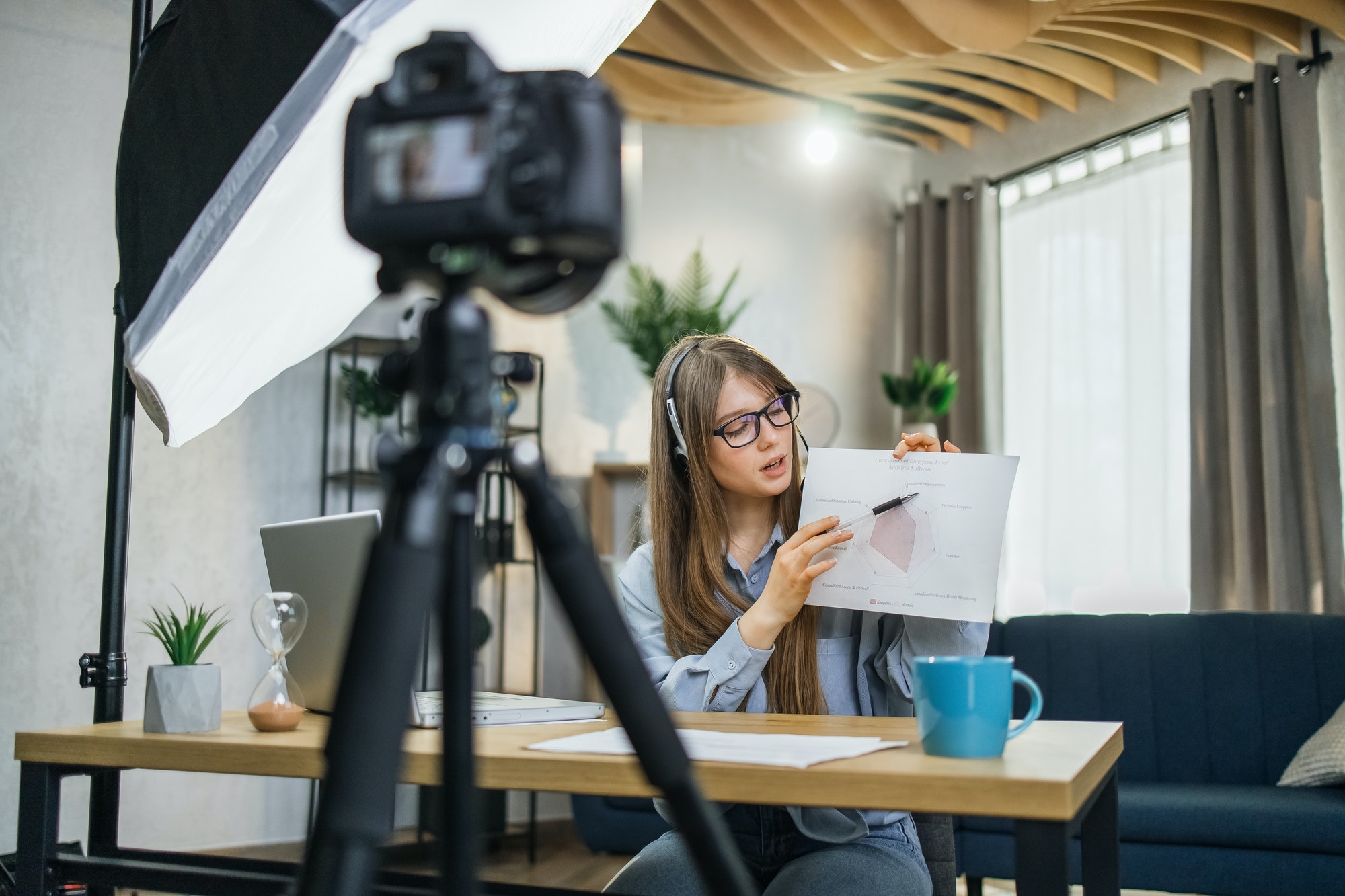 Business woman recording masterclass on video camera